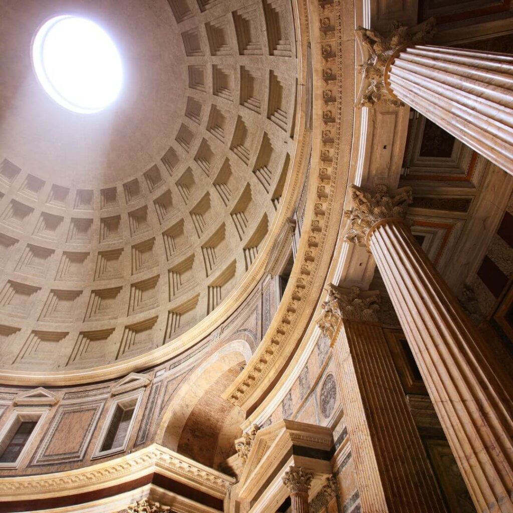The interior of the Pantheon dome in Rome Italy. Light streams into the interior through the 30-foot Oculus in the center of the dome.