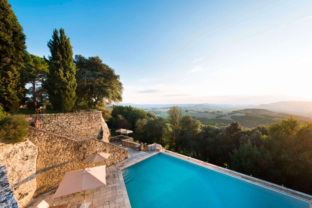 The infinity pool at Borgo Pignano, a luxury Tuscany hotel with views over the Tuscan countryside