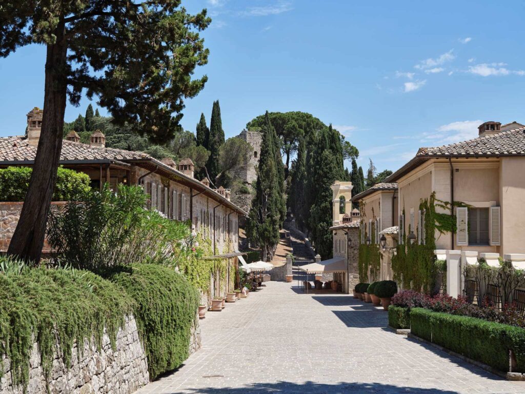The main avenue of the Rosewood Castegion del Bosco, a luxury Tuscany hotel