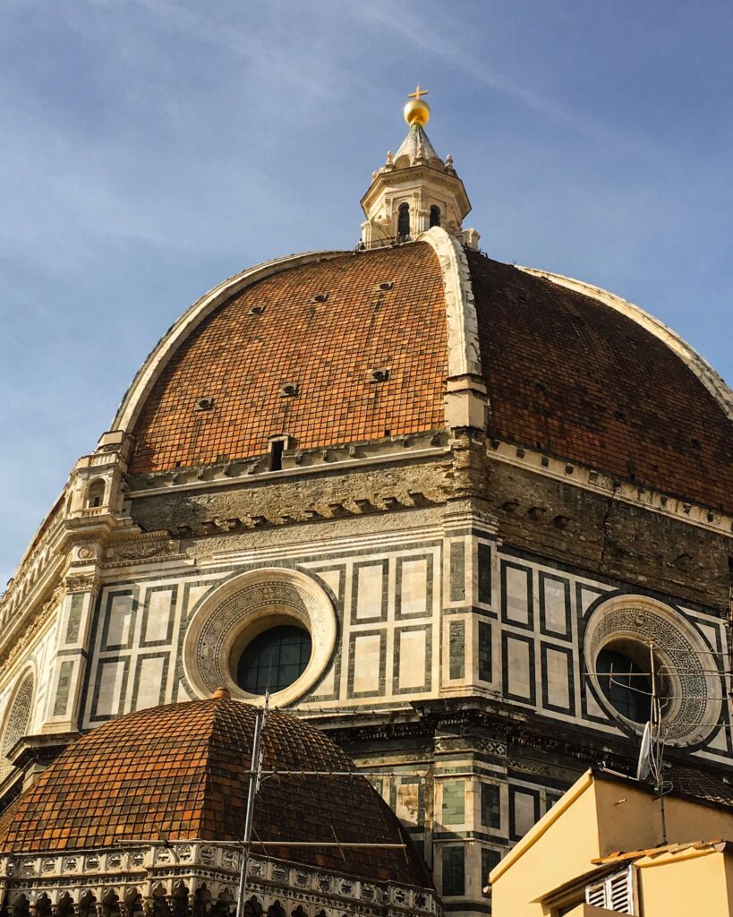 A detailed view of the dome of the Florence Cathedral. You can see the details of the terra cotta tiles used on the dome, as well as the cathedral drum and the windows below