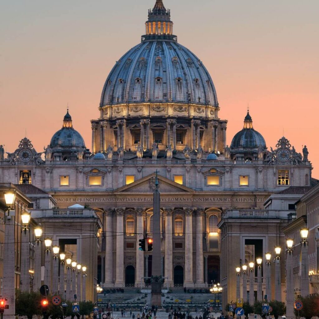 The exterior of St. Peter's Basilica in Vatican City, Rome, Italy at sunset