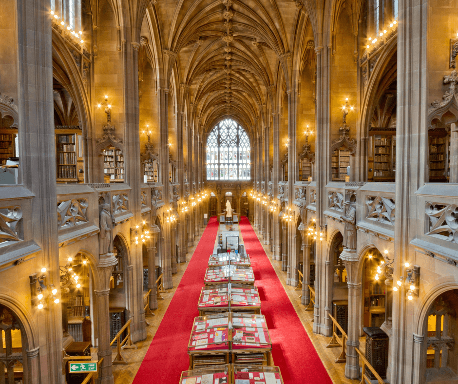 Neo-Gothic reading room at John Rylands Library with vaulted ceilings and stained glass