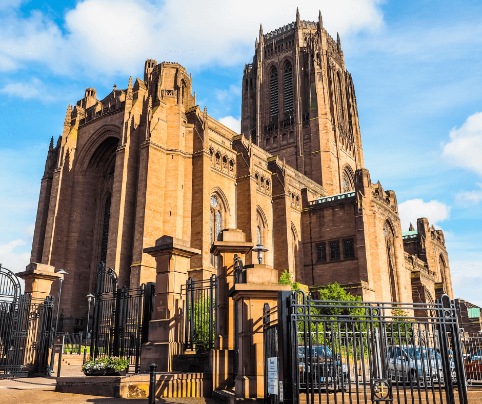 Exterior view of Liverpool Cathedral with its tall sandstone tower and main entrance