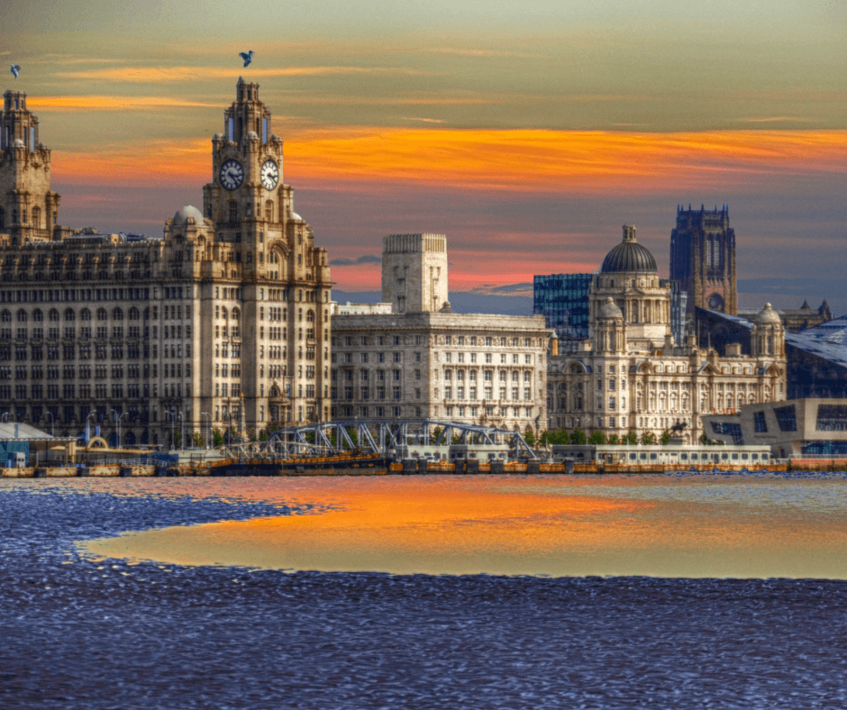 The Royal Liver Building, Cunard Building, and Port of Liverpool Building glowing at sunset