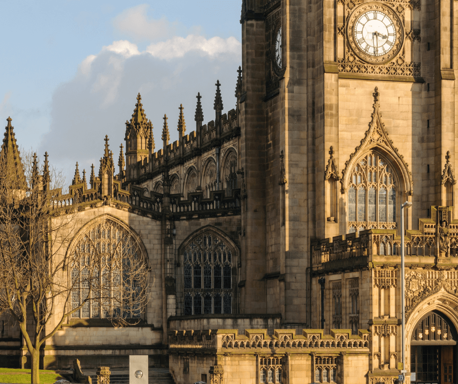 Exterior of Manchester Cathedral with Gothic spires and stone detailing