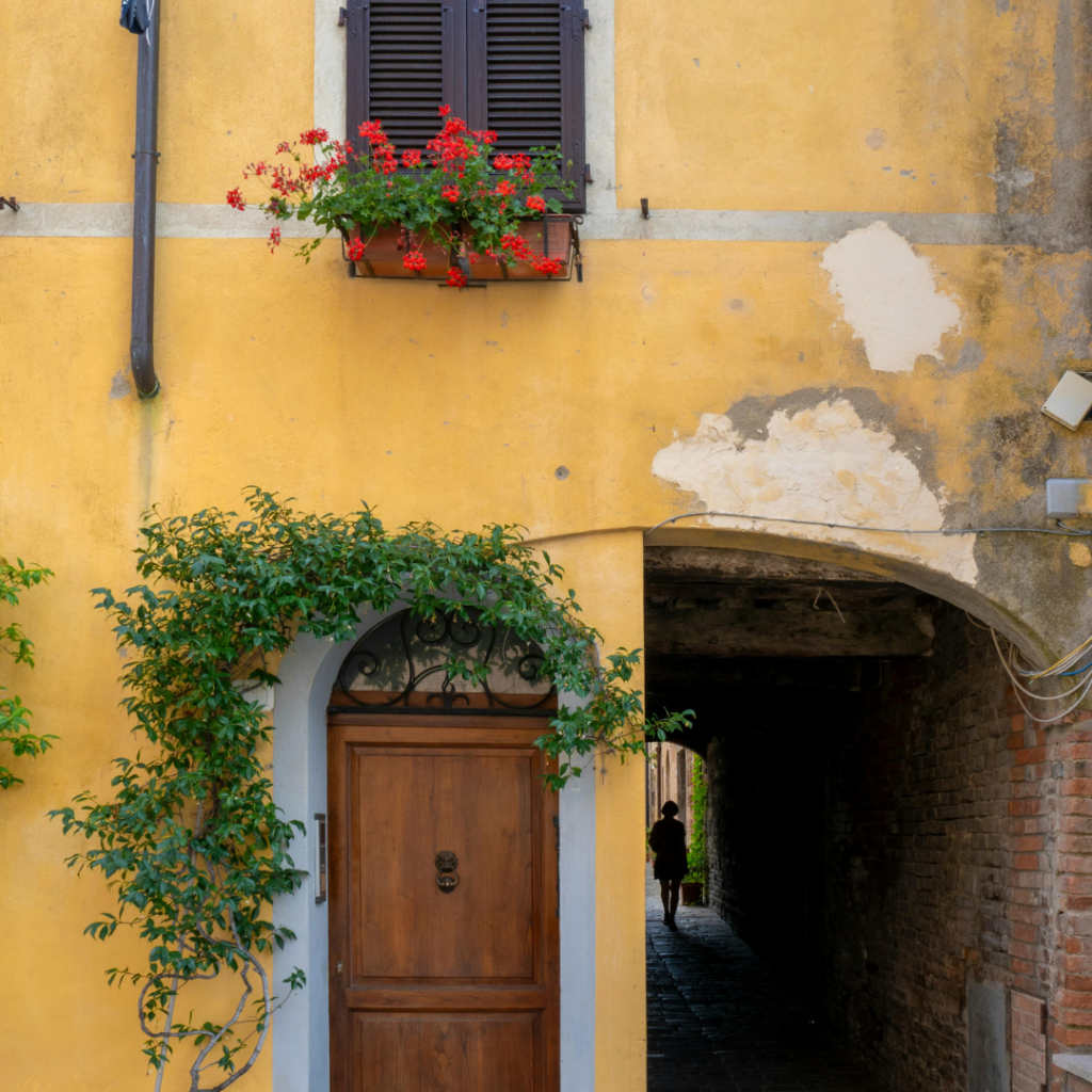 A colorful doorway in Buonconvento, one of the best towns in Tuscany, Italy