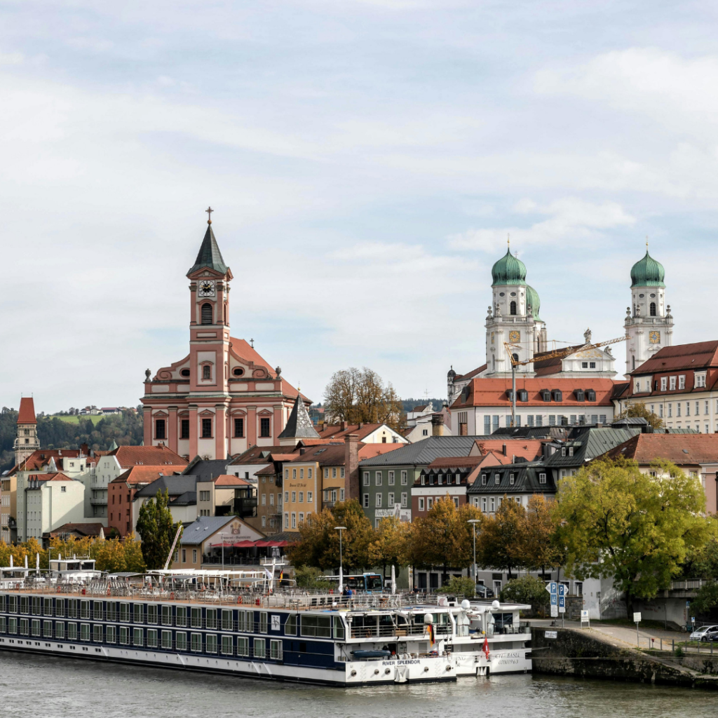 The Danube river in Passau, Germany with river cruise boats moored