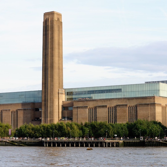 The Tate Modern, with the chimney from the decommissioned power plant standing tall agains the London sky.