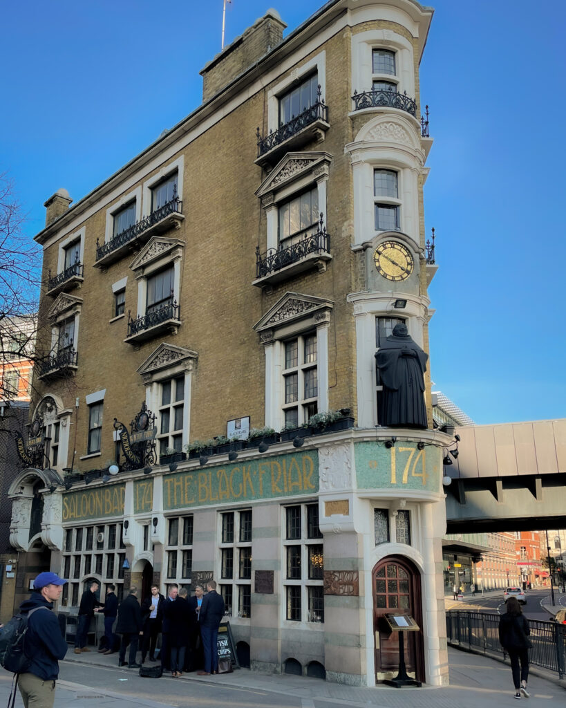 The unique angled facade of The Black Friar Pub in London's Blackfriars neighborhood.