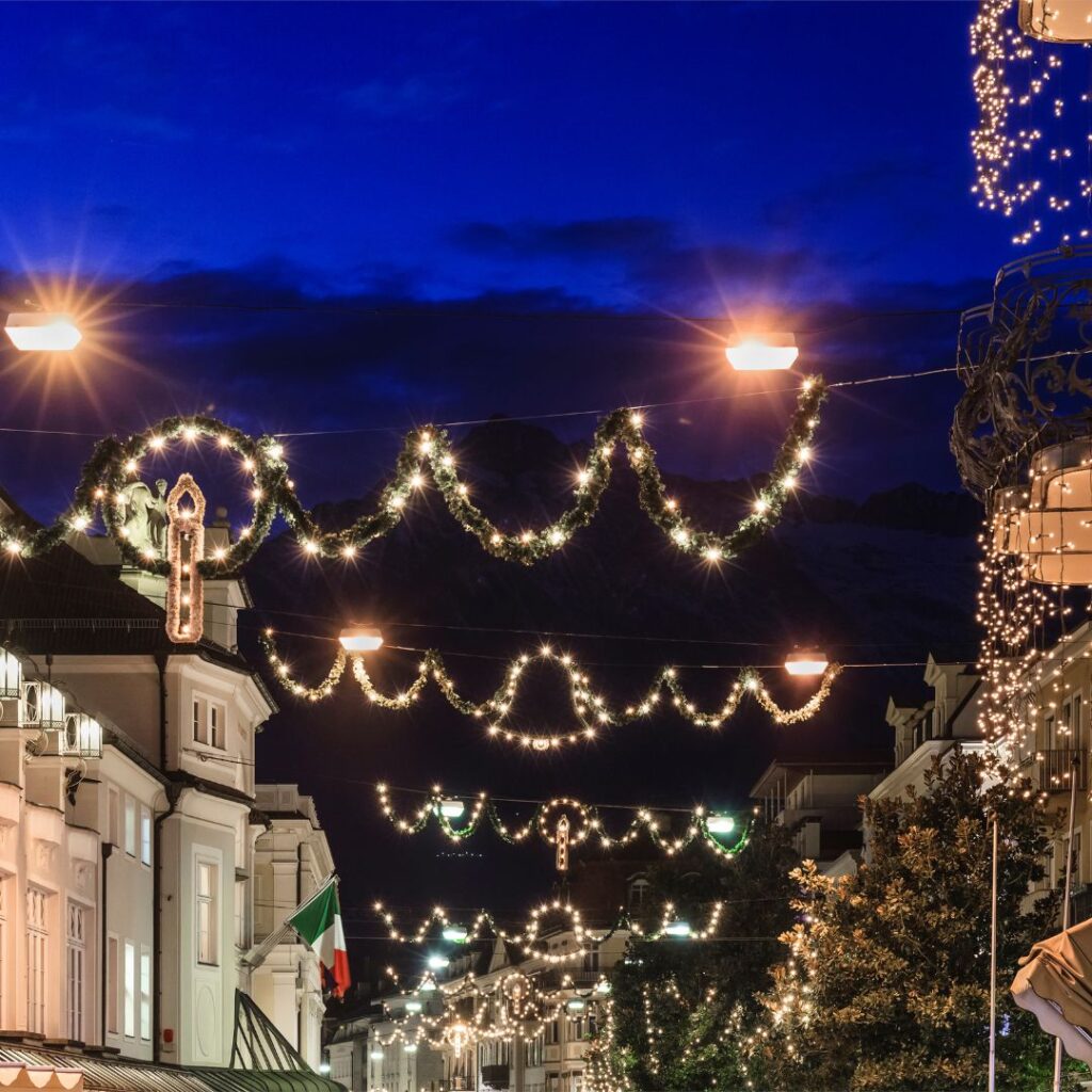 Christmas lights hanging over an Italian street