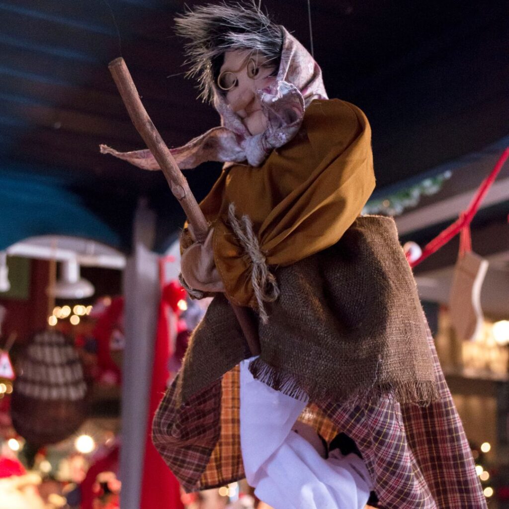 La Befana, the traditional Italian Christmas witch with her broom