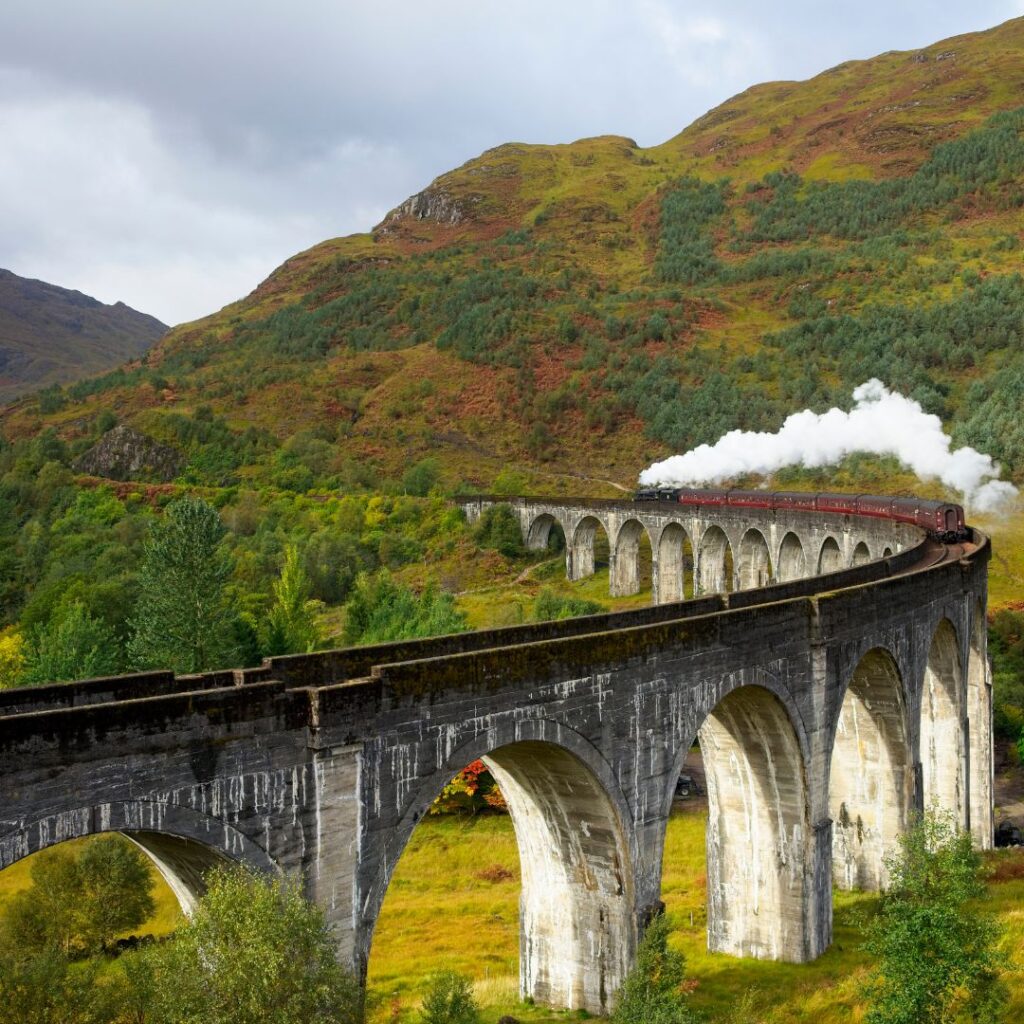 The Jacobite Steam Train making its way across the Glenfinnan Viaduct