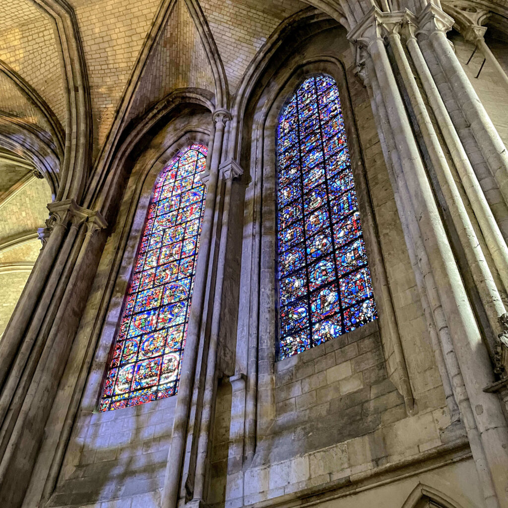 13th century stained glass windows of the Rouen Cathedral, featuring a deep cobalt blue color known as "the blue from Chartres"