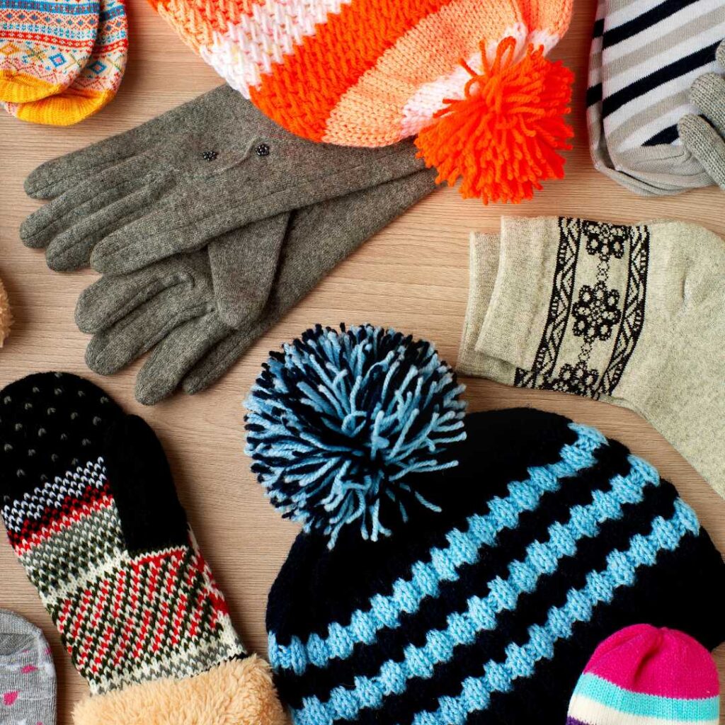 Winter Ireland packing list items including hats, wool socks and gloves