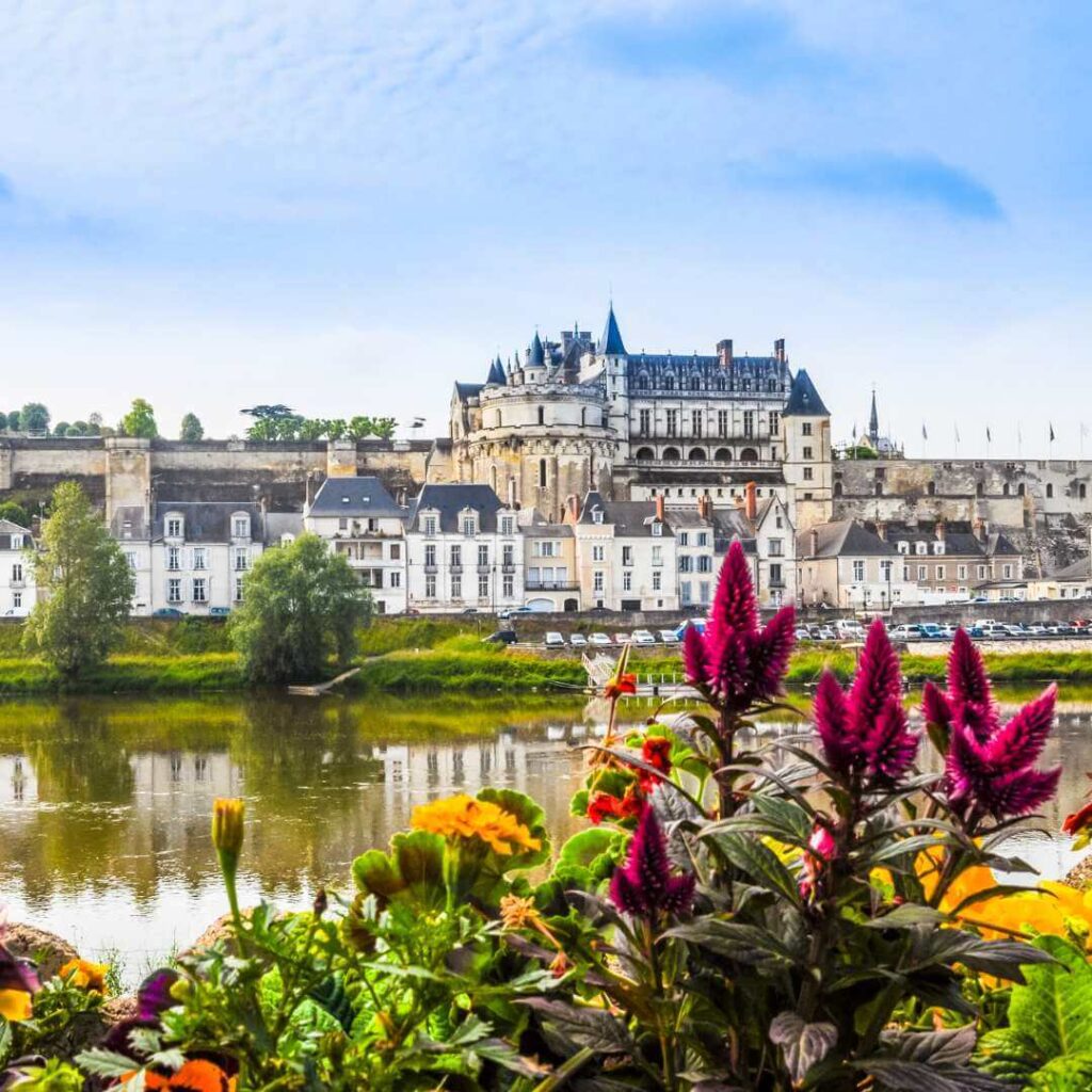 Chateau d'Amboise above the town of Amboise reflected in the calm waters of the Loire river