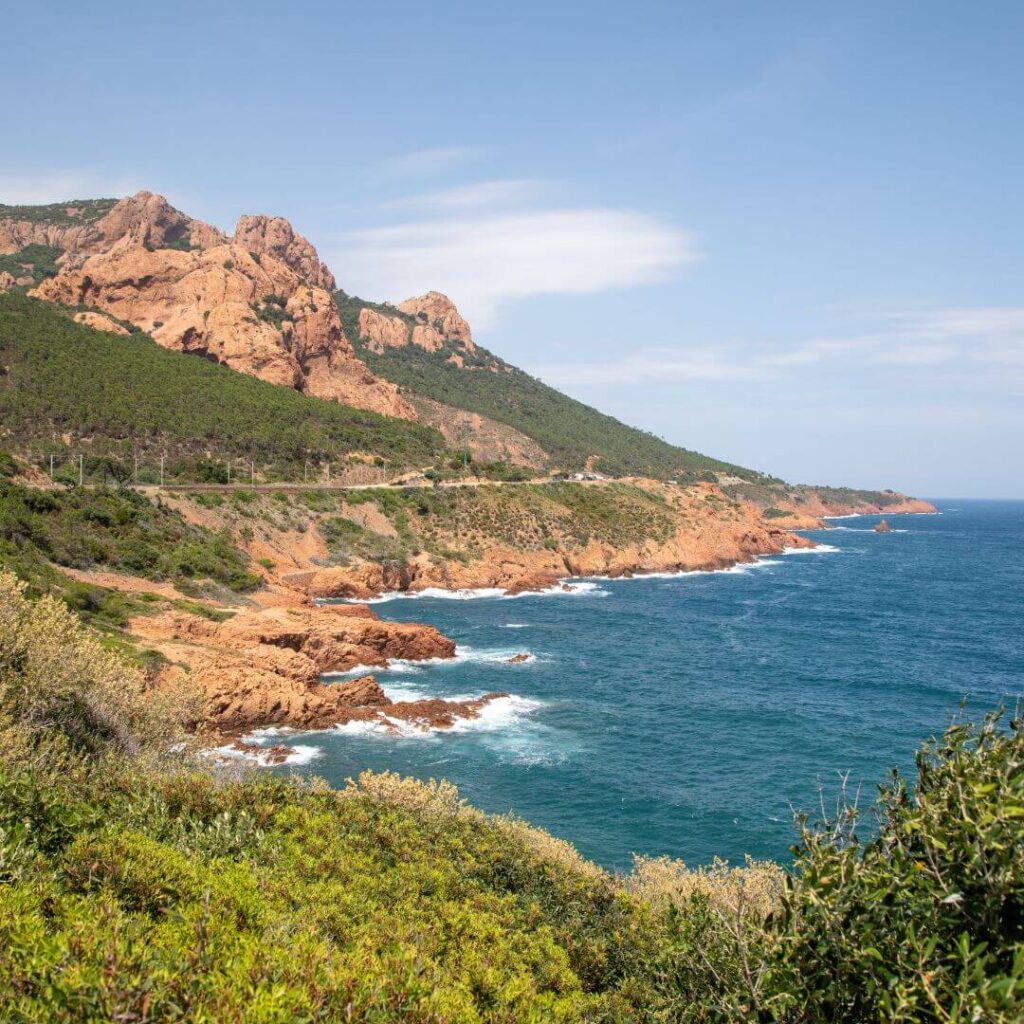 Brown and green coastline along the blue waters of the Mediterranean along the Corniche d'Or