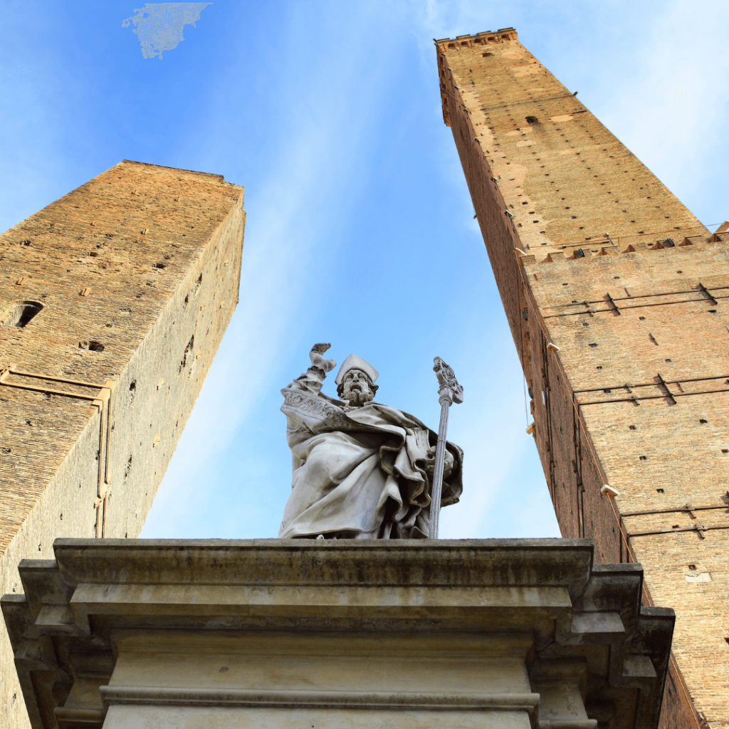 The view looking up at an outdoor statue from the foot of the raised pedestal in Bologna in one of the most iconic regions of Italy