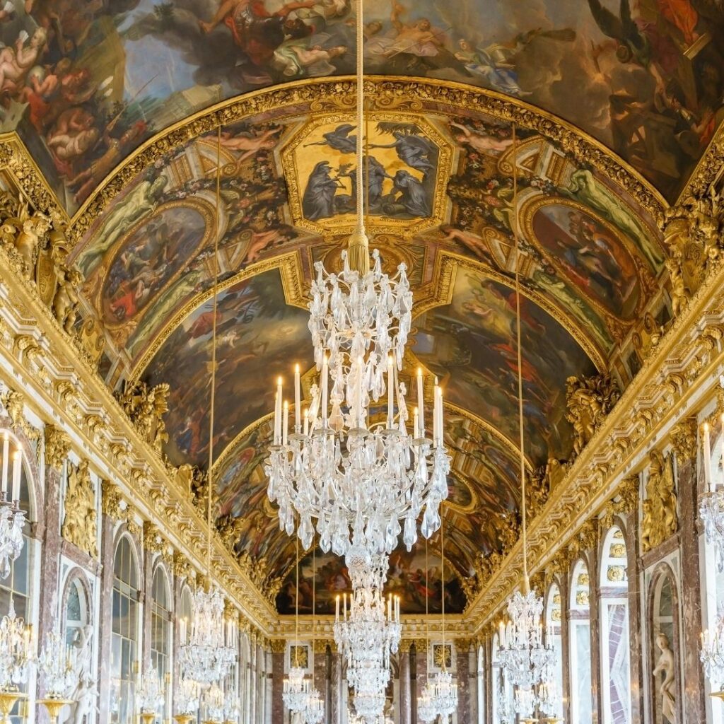 The ceiling, chandeliers and mirrors that are seen when visiting Versailles and walking along the Hall of Mirrors