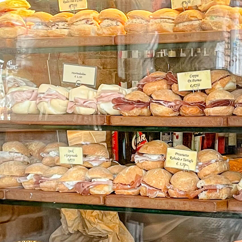 Stacks of cicchetti in a shop window in Venice