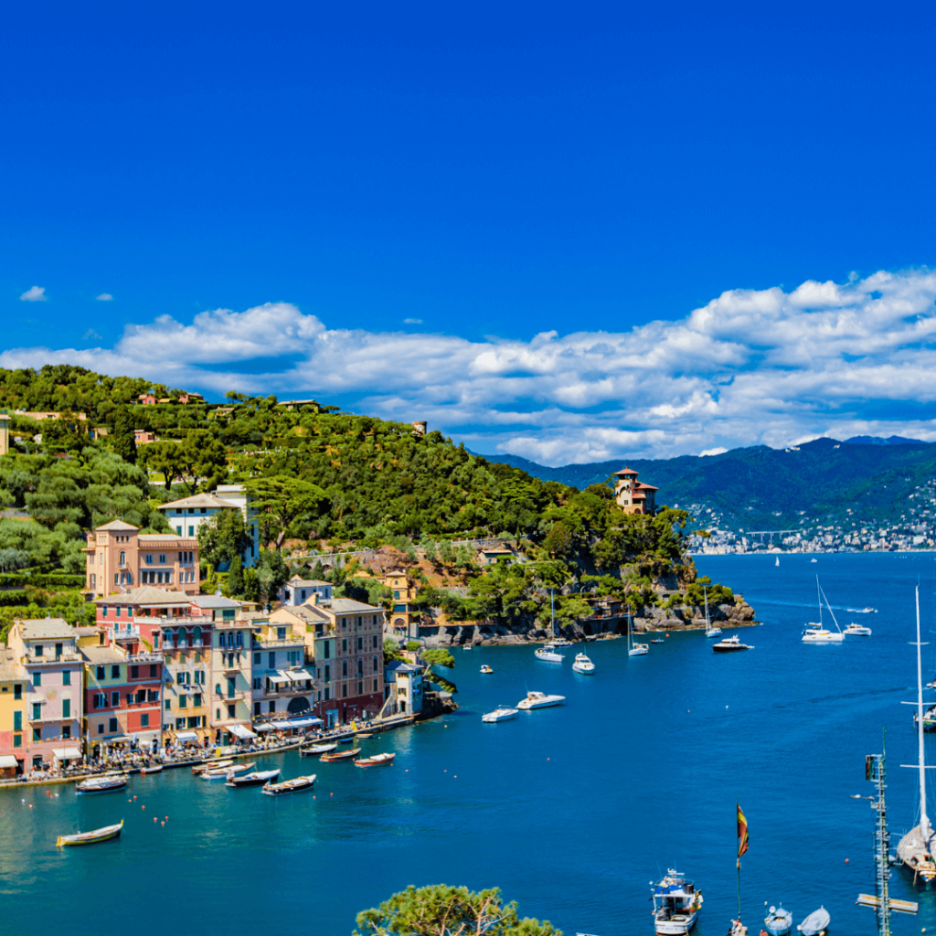 The hills of Portofino cascading down the green hillside to the blue waters of the Mediterranean in Liguria, one of the regions of Italy