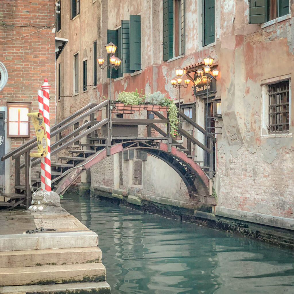 A private bridge to a restaurant over a Venetian canal and the oldest bridge in Venice, one of the lesser-known Venice Italy facts