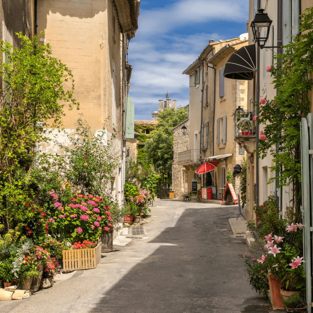 Flower-lined streets in the beautiful city of Saignon, one of the best towns in Provence