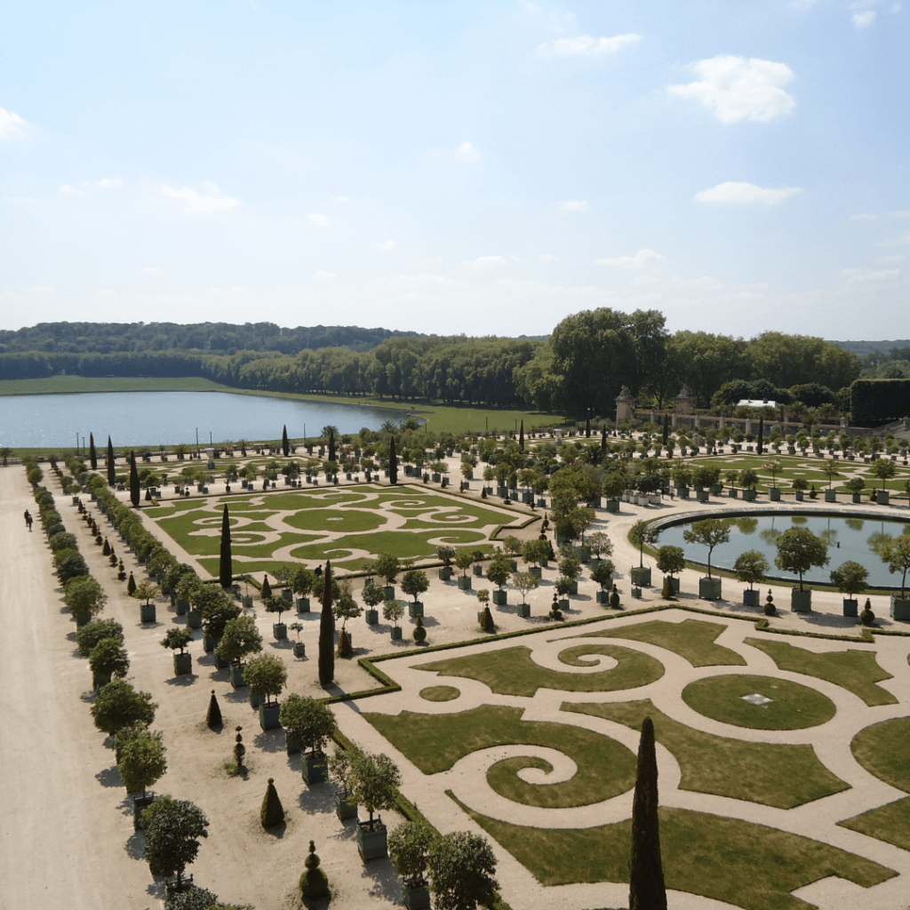 Overlooking the manicured gardens of Versailles, one of the common day trips from Paris