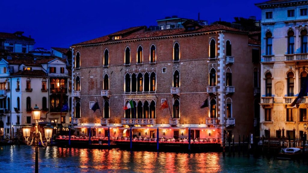 Lighted view of the Gritti Palace, one of the luxury hotels in Venice Italy, at night from the Grand Canal